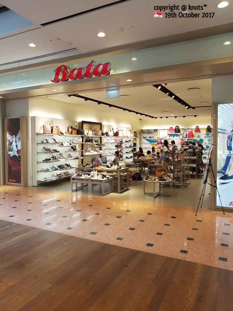 The entrance of a Bata shoe store, showcasing a wide range of footwear and accessories inside.