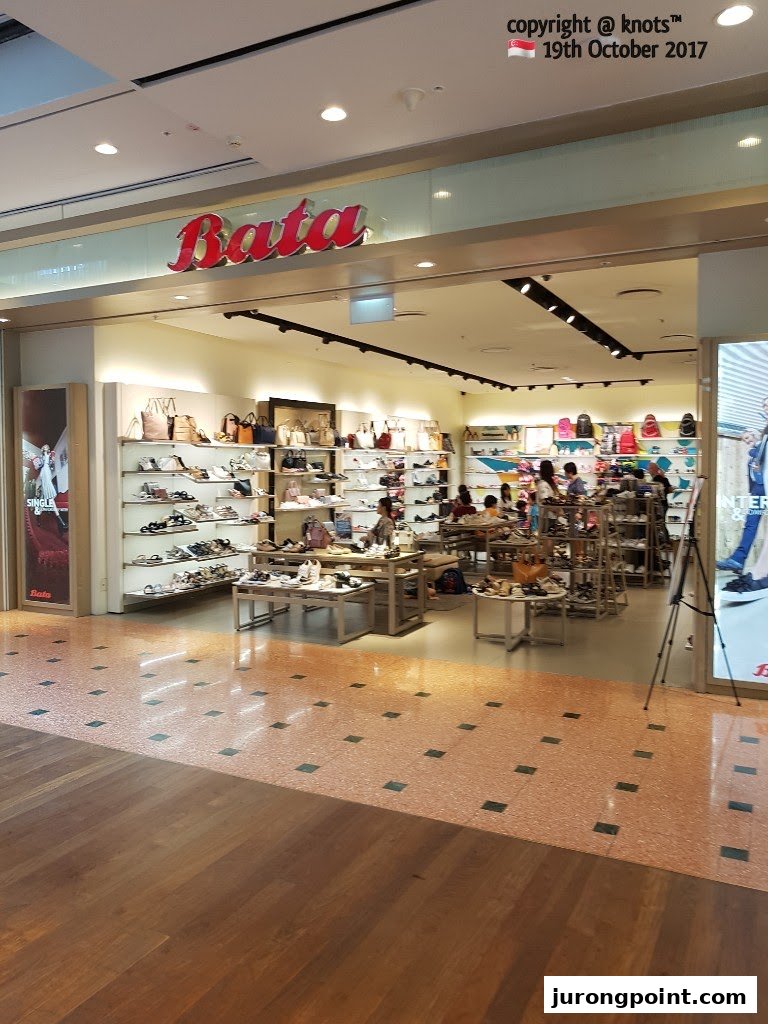 The entrance of a Bata shoe store, showcasing a wide range of footwear and accessories inside.