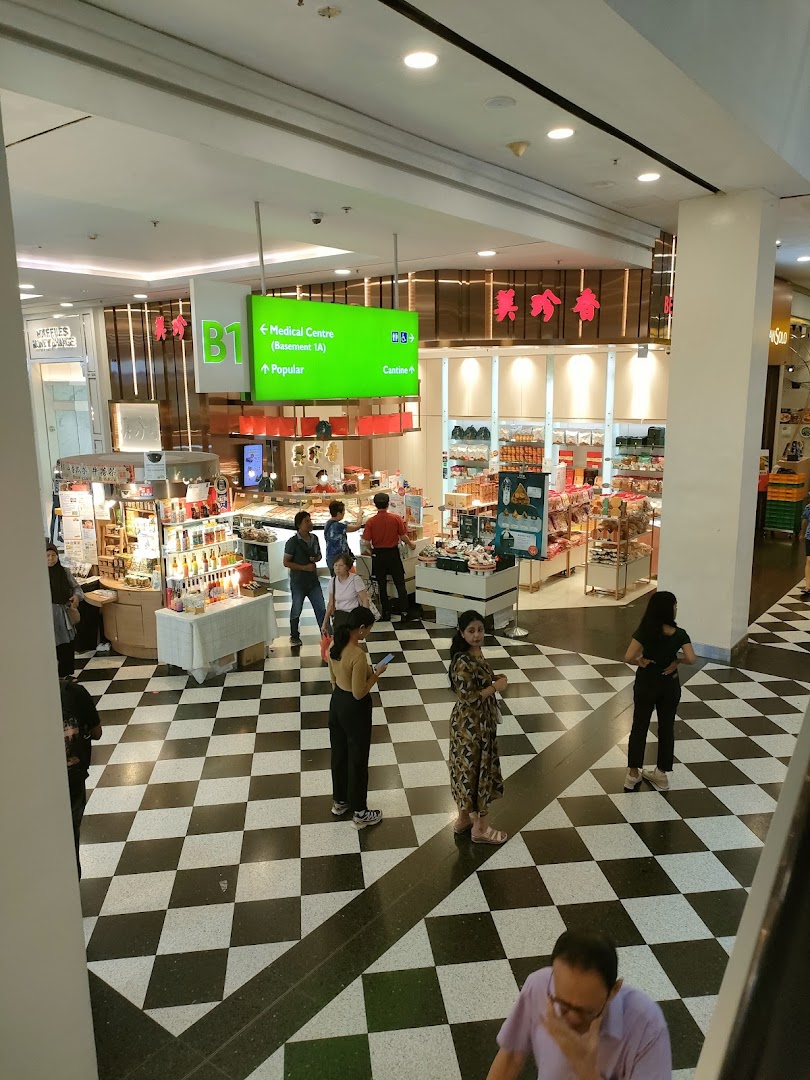 A wide view of Bee Cheng Hiang's shop floor in a mall, showcasing products and customer activity.