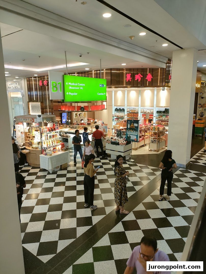 A wide view of Bee Cheng Hiang's shop floor in a mall, showcasing products and customer activity.