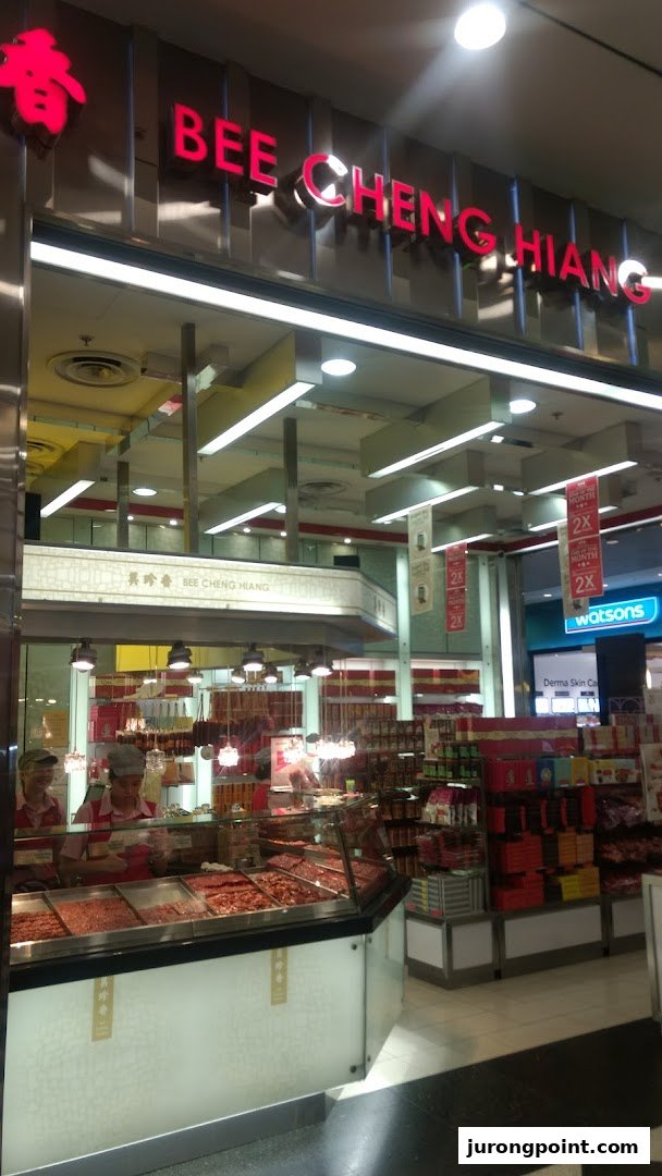 A vibrant view of Bee Cheng Hiang's shop front, showcasing their famous bak kwa and inviting interior.