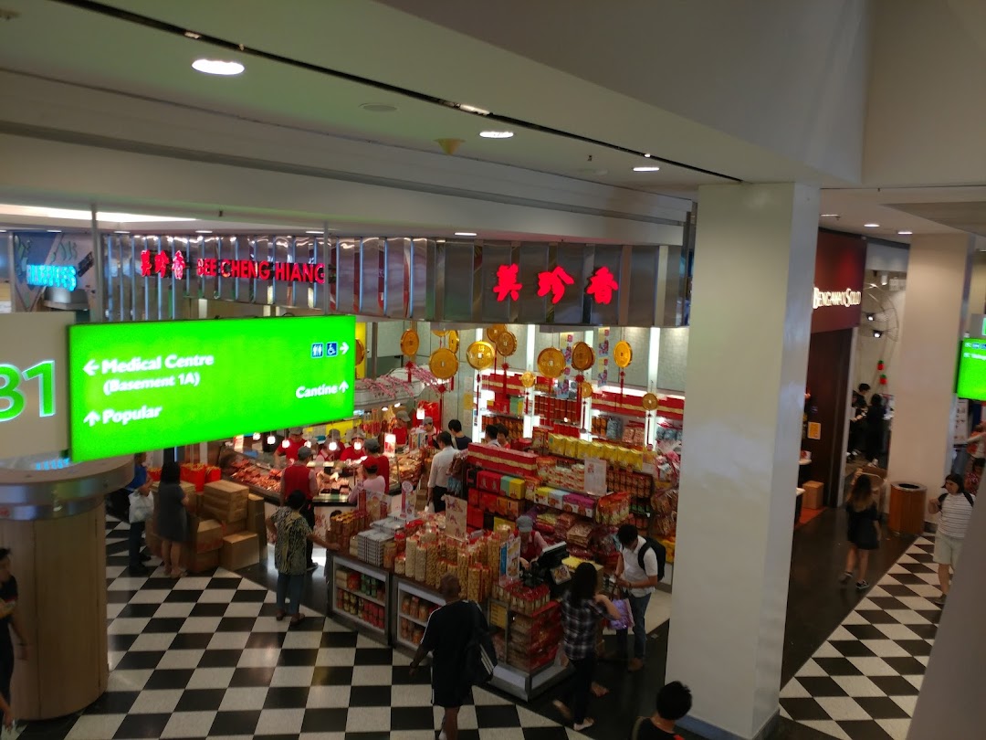 An overhead view of Bee Cheng Hiang shop, showcasing its products and customers in a bustling mall.