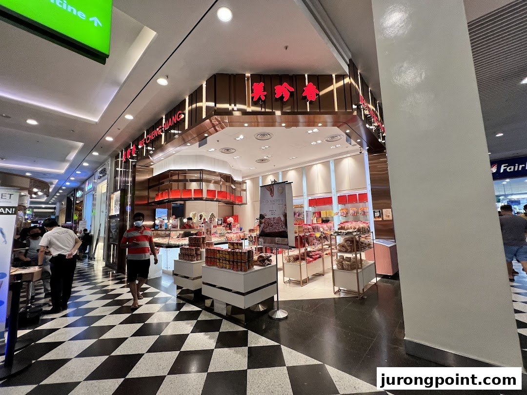 The inviting storefront of Bee Cheng Hiang, showcasing its traditional bak kwa and snacks in a bustling mall.