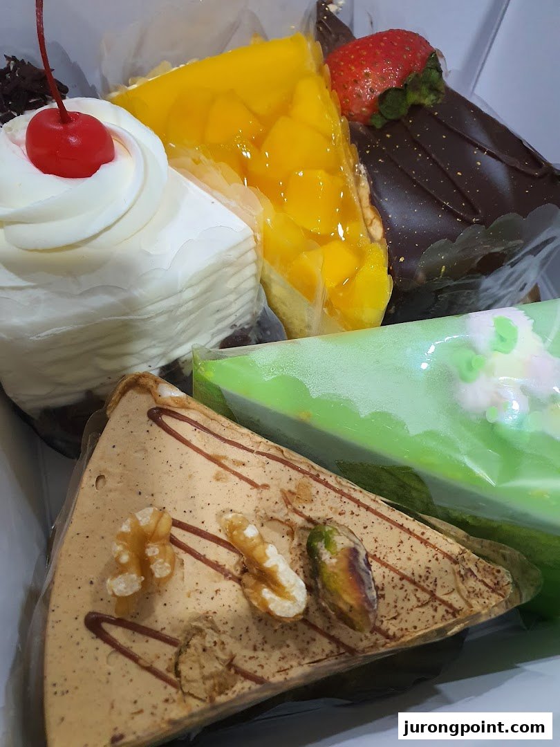 A vibrant assortment of delicious cake slices, featuring various flavors and toppings.