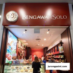 The shopfront of Bengawan Solo, a bakery and cake shop, with customers inside.