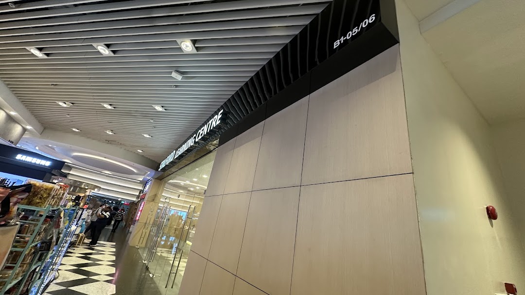 A view of a shop entrance with a 'Learning Centre' sign and unit number B1-05/06 in a shopping mall.