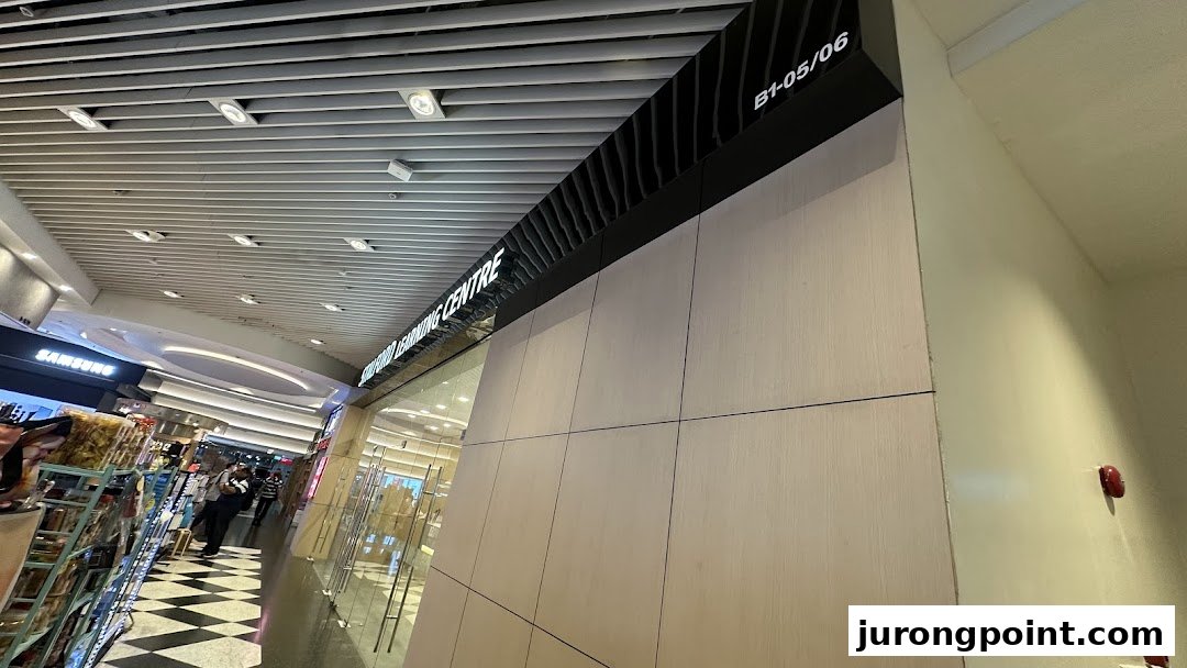 A view of a shop entrance with a 'Learning Centre' sign and unit number B1-05/06 in a shopping mall.