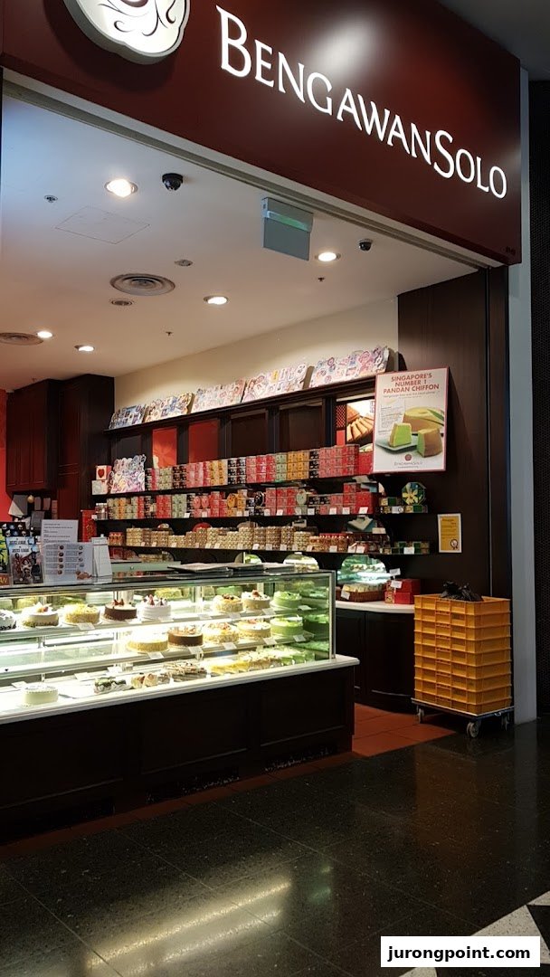 The brightly lit entrance of Bengawan Solo, featuring a display of cakes and traditional pastries.