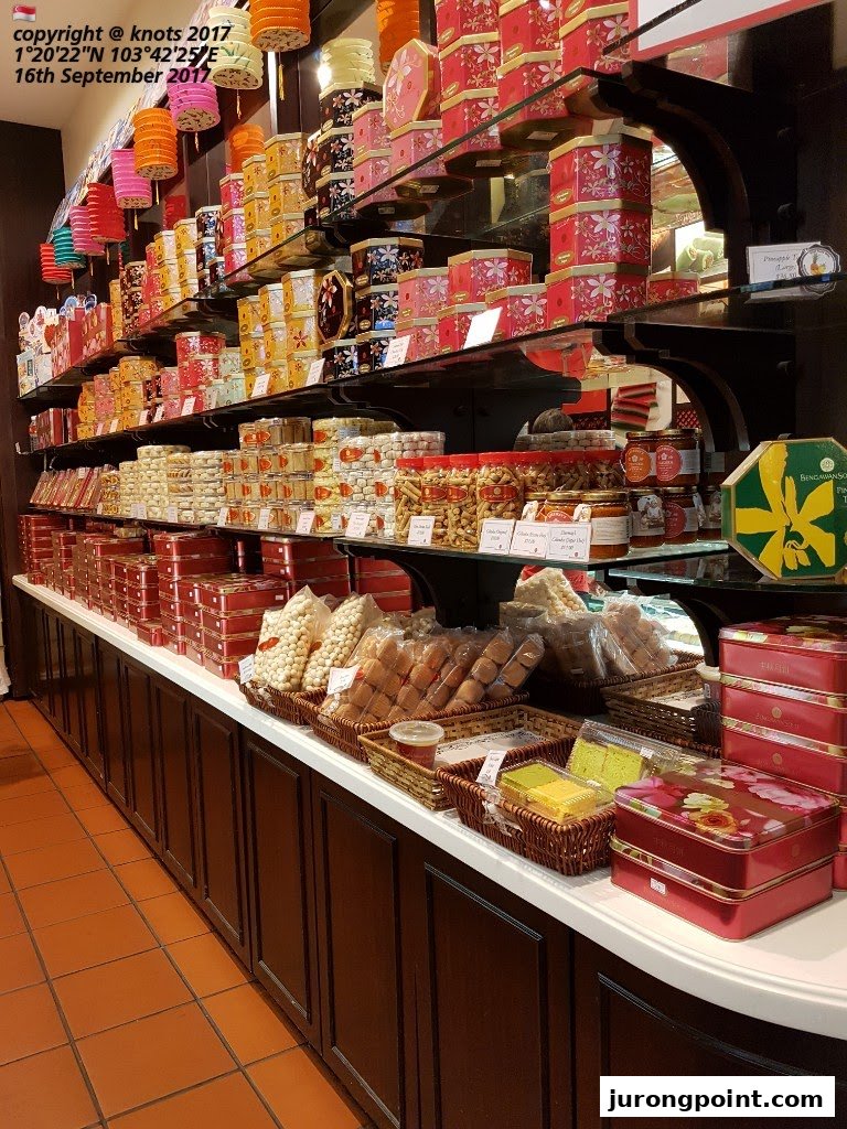 Shelves filled with beautifully packaged traditional Indonesian snacks, cookies, and cakes at Bengawan Solo.
