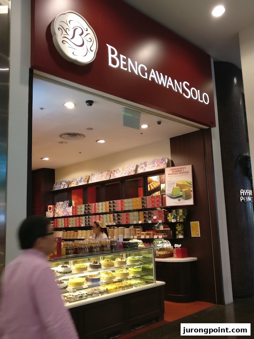 The brightly lit shopfront of Bengawan Solo, showcasing a display of cakes and pastries.