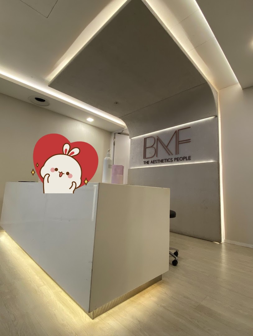 Interior view of BMF - The Aesthetics People reception area with a modern desk and logo.