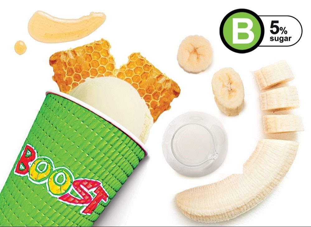 A Boost Juice cup with smoothie, honey, honeycomb, and banana, highlighting 5% sugar content.