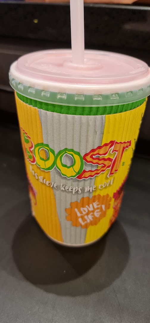A vibrant Boost Juice cup with a straw, featuring the brand logo and 'Love Life' slogan.
