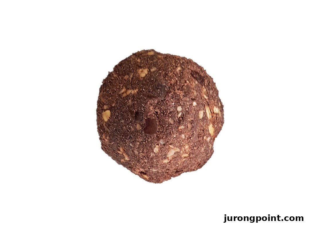 A close-up of a delicious chocolate and nut energy ball from Boost Juice on a white background.