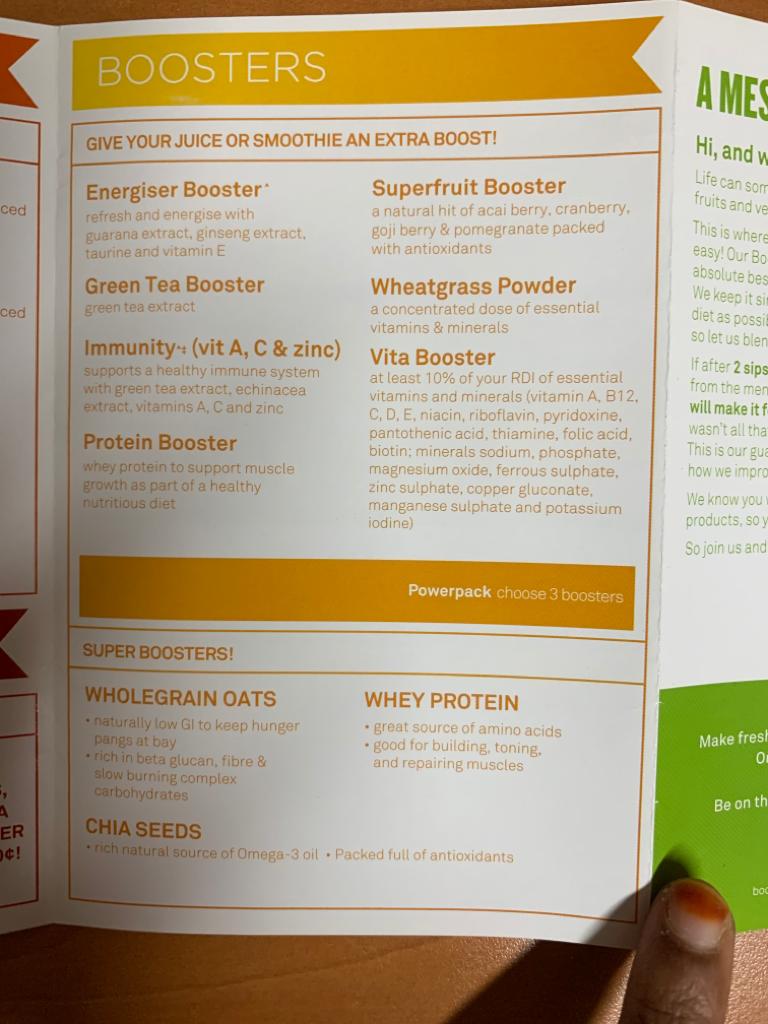 A close-up of Boost Juice's menu detailing various juice and smoothie boosters.