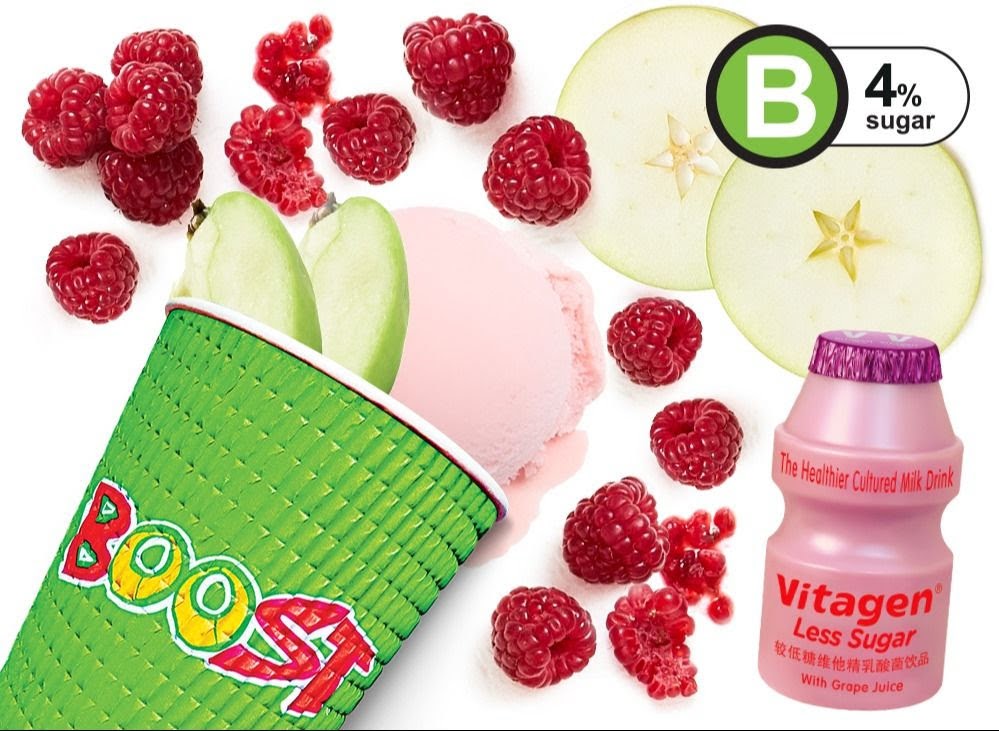 A vibrant flat lay showcasing fresh raspberries, apple slices, ice cream, and a Boost Juice cup.