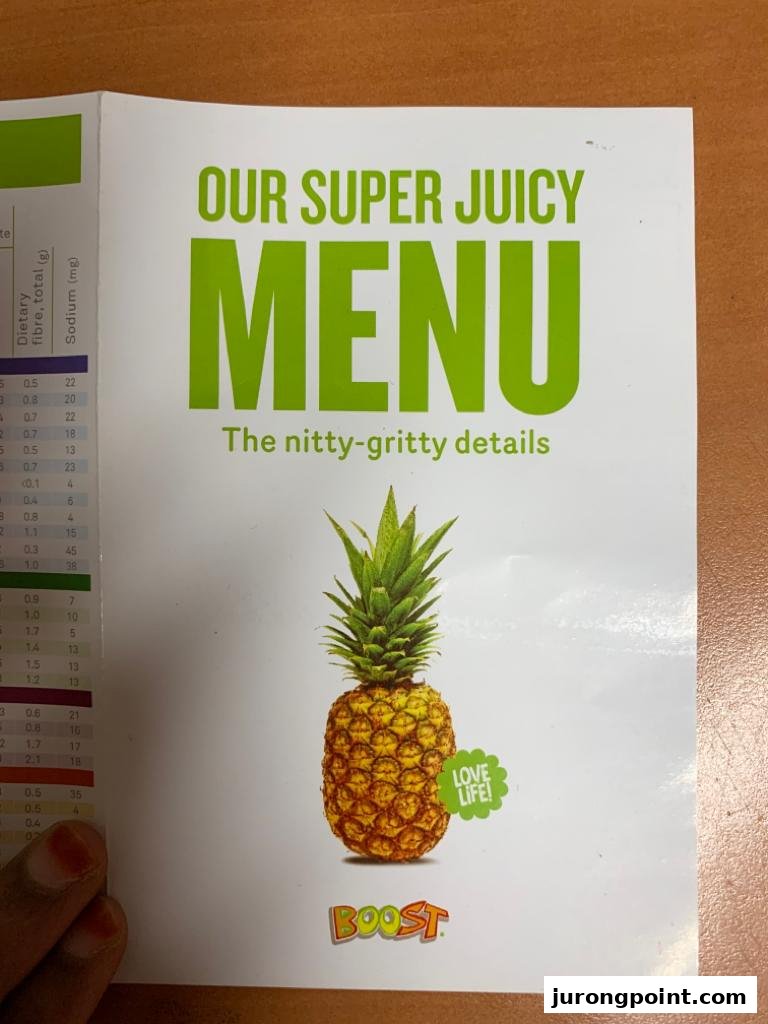 Cover of a Boost Juice menu booklet featuring a pineapple and the title 'OUR SUPER JUICY MENU'.