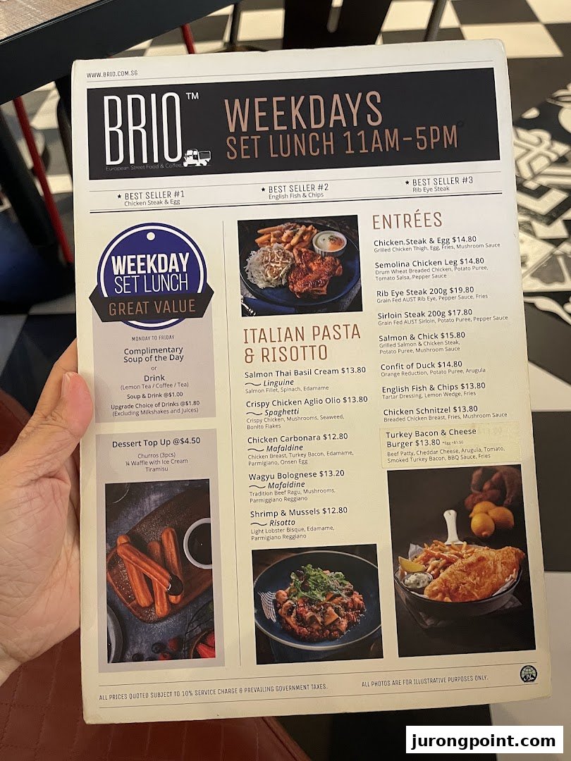 A hand holds a Brio restaurant menu displaying weekday set lunch options, Italian pasta, risotto, and entrées.