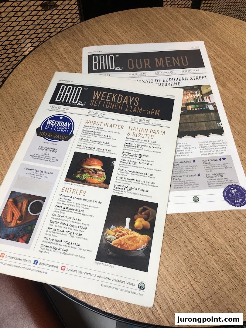 A detailed menu from Brio restaurant, showcasing various dishes and prices on a wooden table.