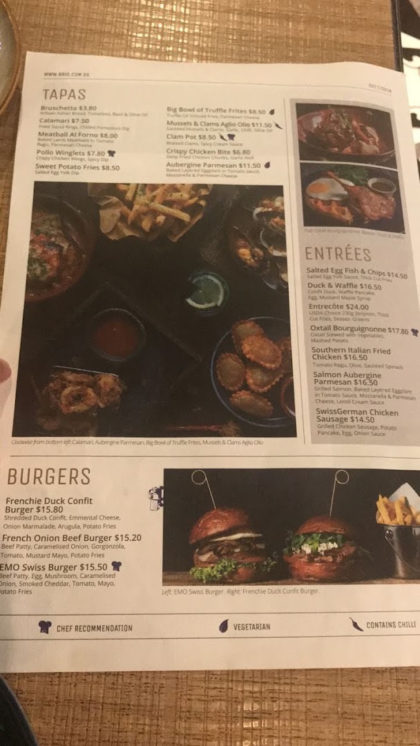 A detailed menu from Brio restaurant showcasing tapas, entrees, and gourmet burgers with prices.
