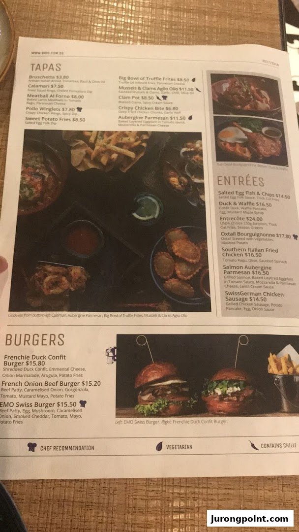 A detailed menu from Brio restaurant showcasing tapas, entrees, and gourmet burgers with prices.