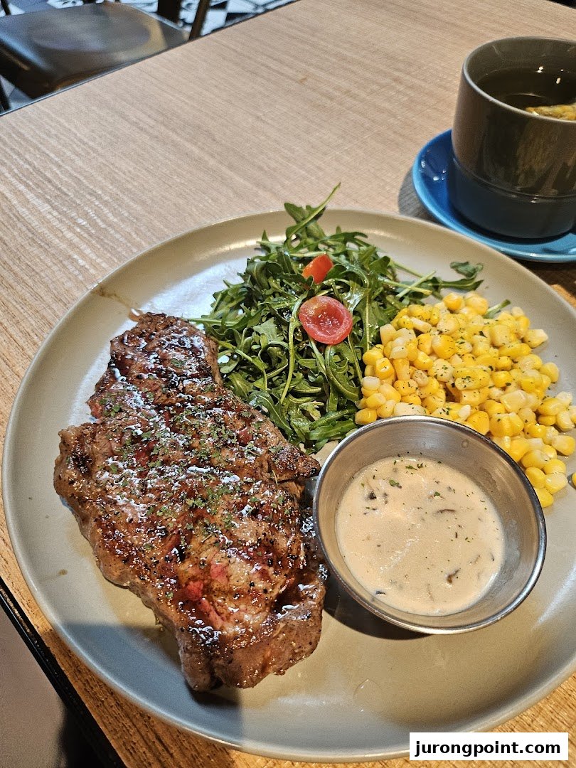 A delicious steak served with fresh greens, corn, and a creamy mushroom sauce.