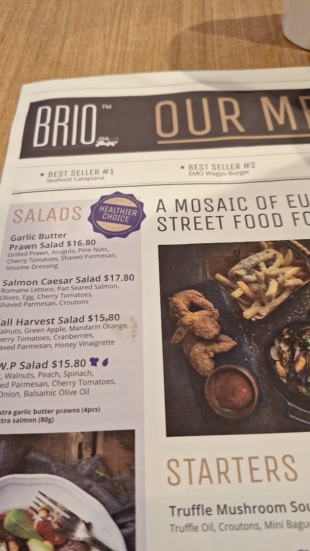A close-up of Brio's menu, featuring salads, best sellers, and starters.