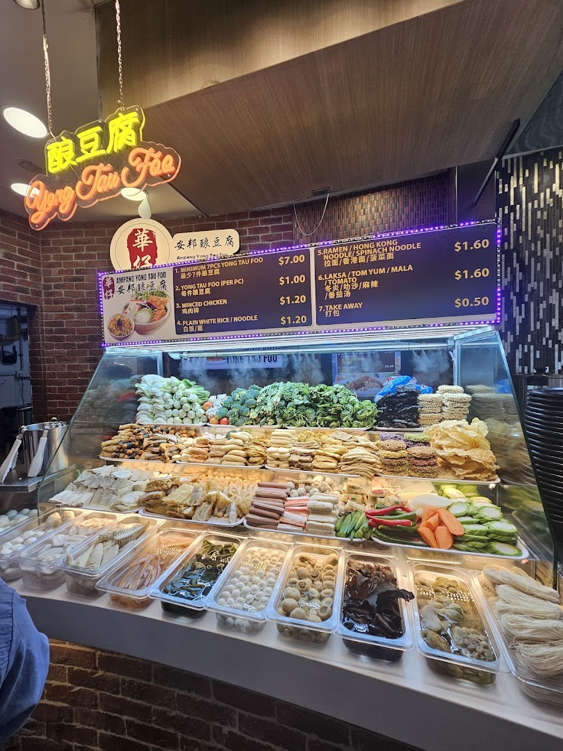 A vibrant display of Yong Tau Foo ingredients and a clear menu board at Cantine by Kopitiam.