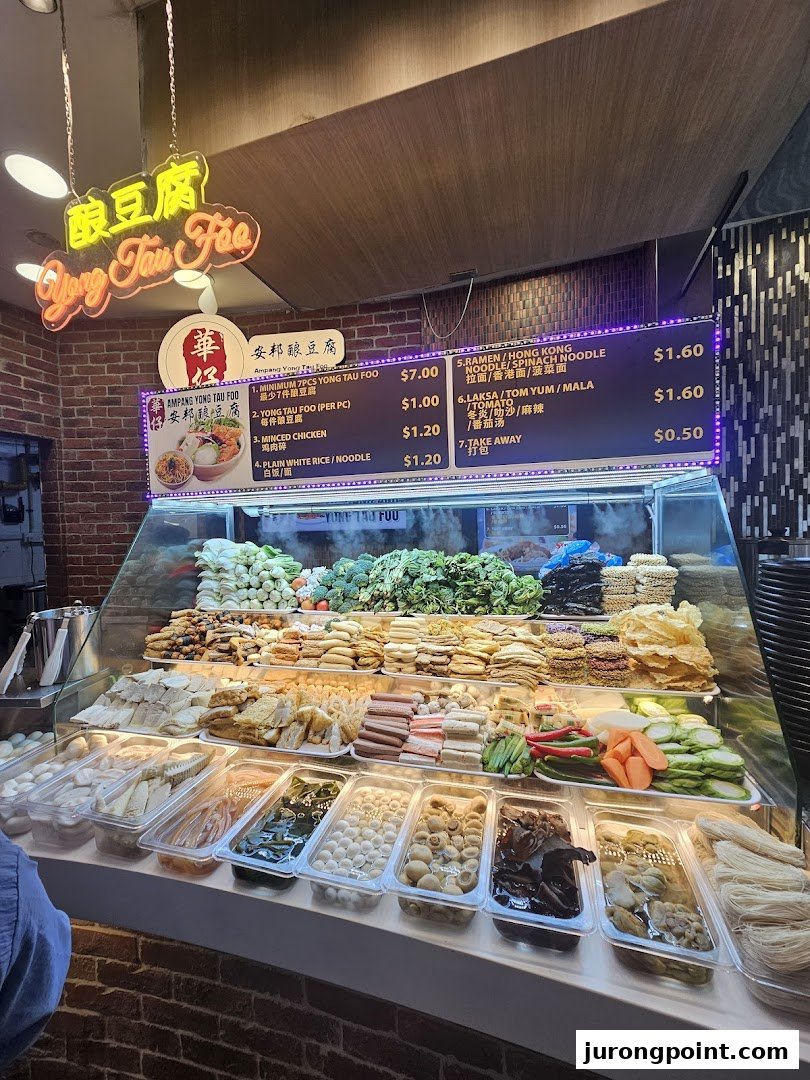 A vibrant display of Yong Tau Foo ingredients and a clear menu board at Cantine by Kopitiam.