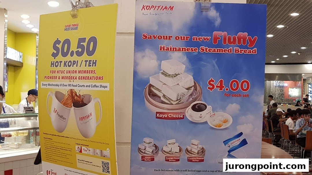 Two promotional posters for Kopitiam, featuring a discounted coffee/tea offer and Hainanese steamed bread sets.