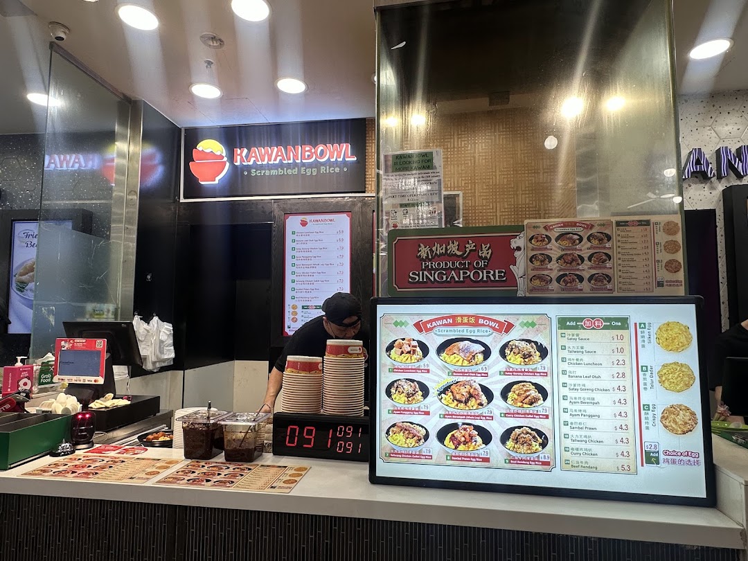Interior view of Kawanbowl, a scrambled egg rice shop, showing the counter and menu displays.