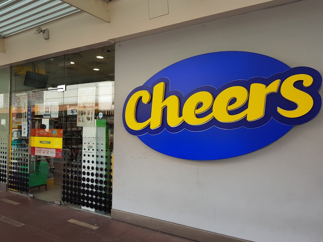 Exterior view of Cheers convenience store entrance with its distinctive blue and yellow logo.