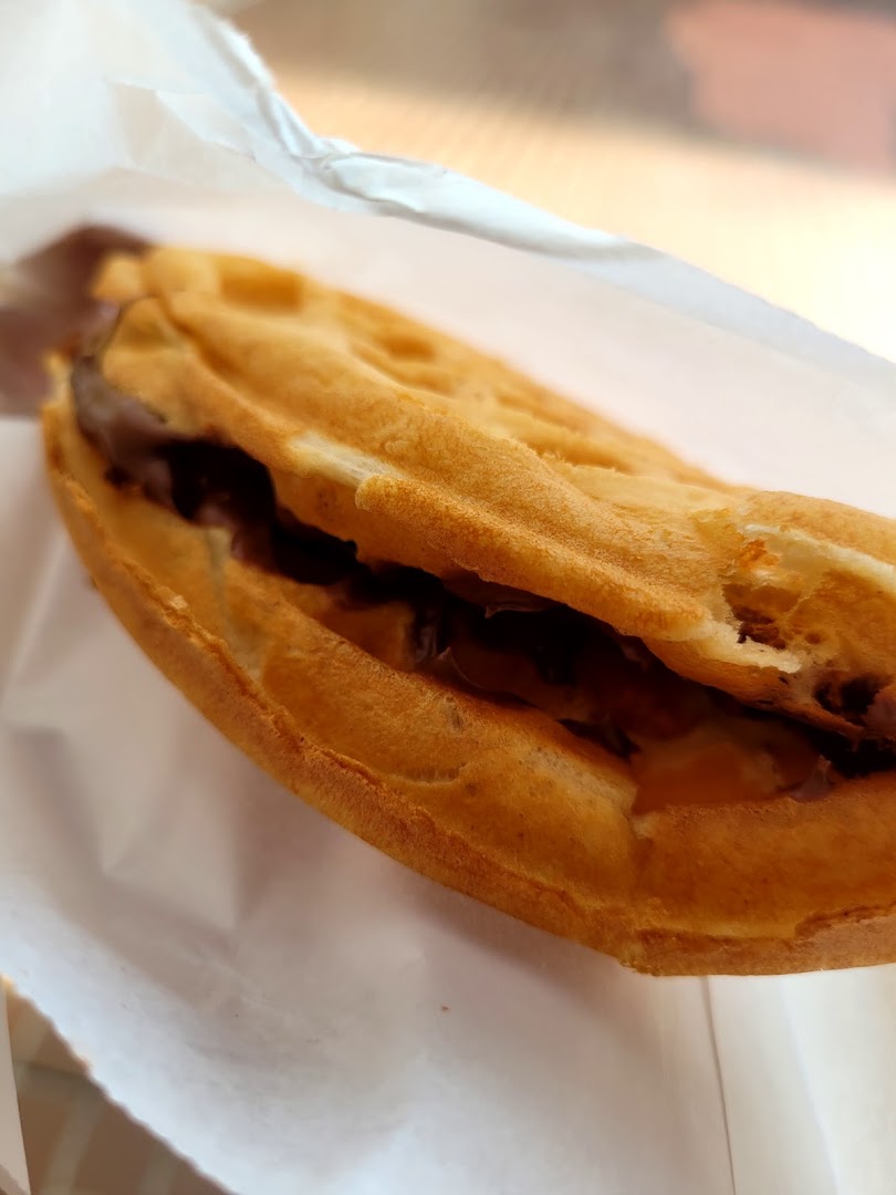 A delicious chocolate-filled waffle, served in a paper wrapper, from Cheers.