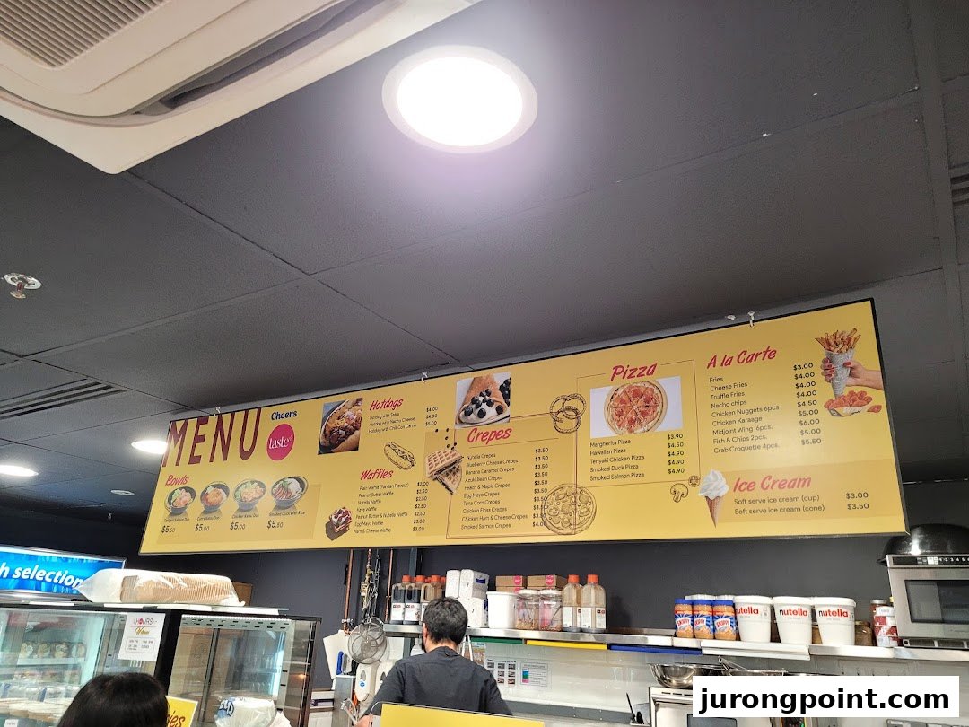 A bright menu board at Cheers displaying various food items like hotdogs, pizzas, crepes, waffles, and ice cream.
