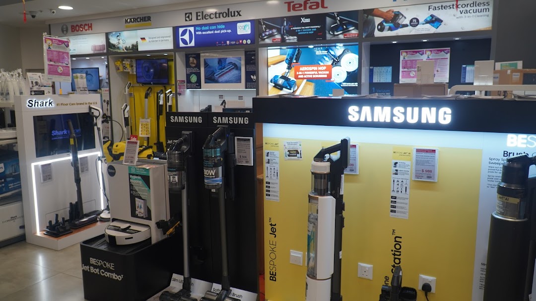An interior shot of COURTS showcasing a wide range of vacuum cleaners and home cleaning appliances.