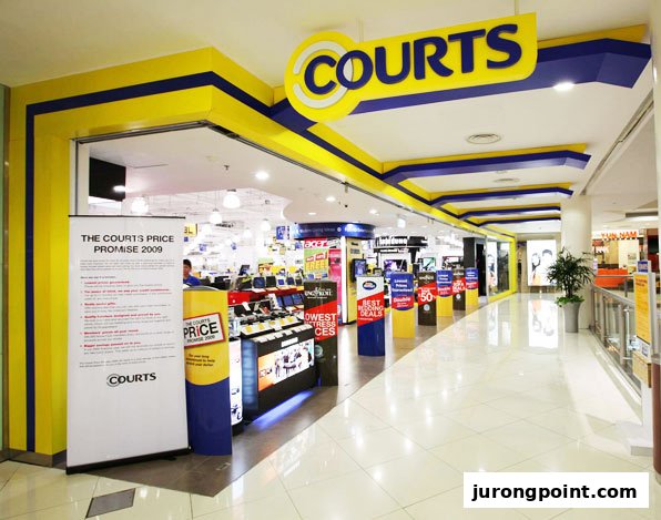 The vibrant yellow and blue entrance of COURTS, an electronics and furniture store, within a shopping mall.