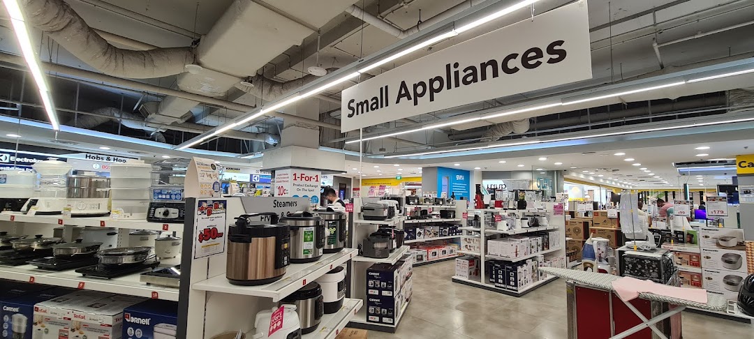 An interior view of COURTS, showcasing a wide array of small kitchen and home appliances on display.
