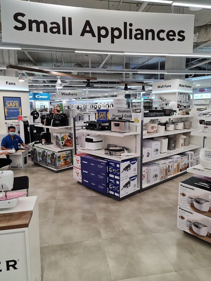 Interior view of COURTS' small appliances section, showcasing various kitchen and home electronics.