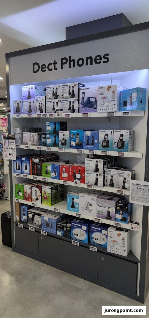 A retail display shelf showcasing a wide selection of Dect Phones from various brands.