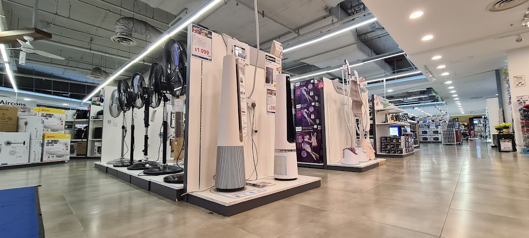 Interior view of COURTS electronics store showcasing a wide range of fans and home appliances.