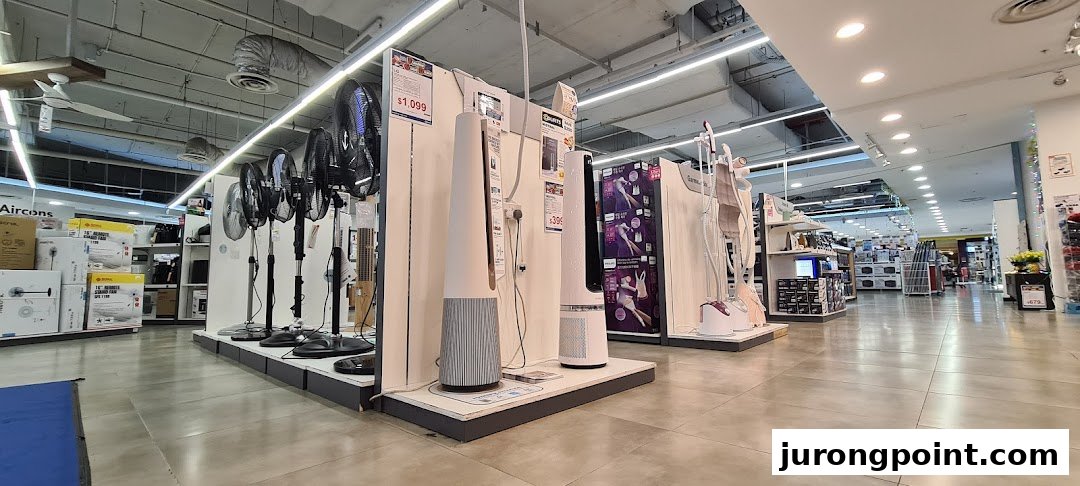 Interior view of COURTS electronics store showcasing a wide range of fans and home appliances.
