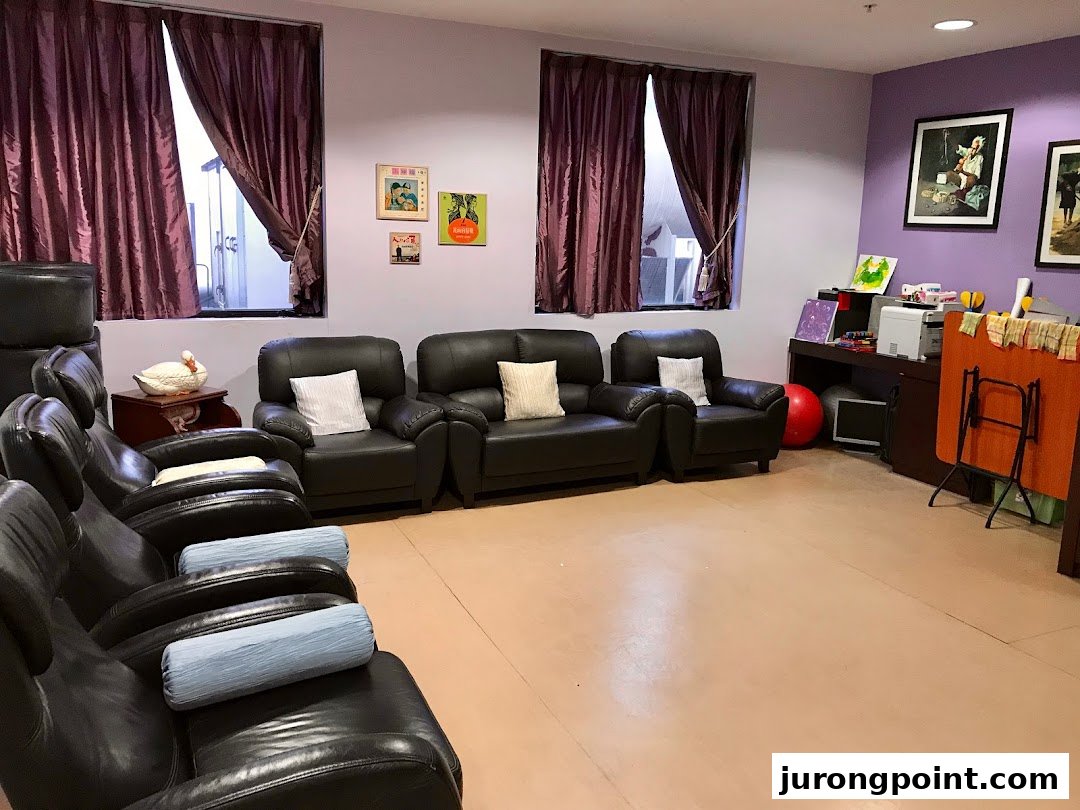 A comfortable lounge area with various seating, including recliners and sofas, in a supportive center.