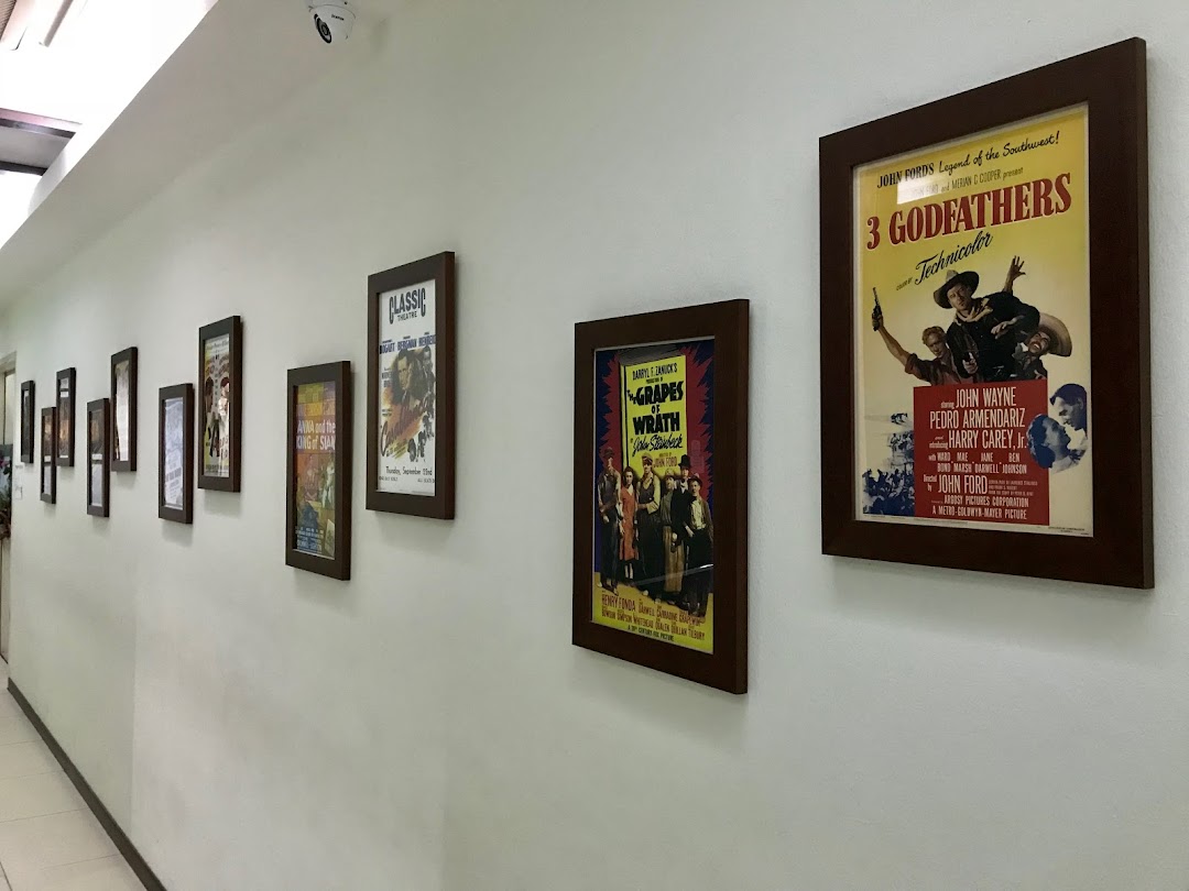 A hallway adorned with framed vintage movie posters, creating a classic ambiance.