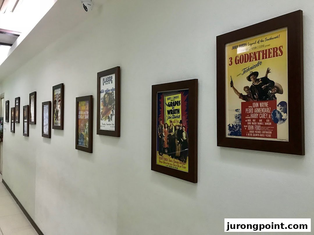 A hallway adorned with framed vintage movie posters, creating a classic ambiance.