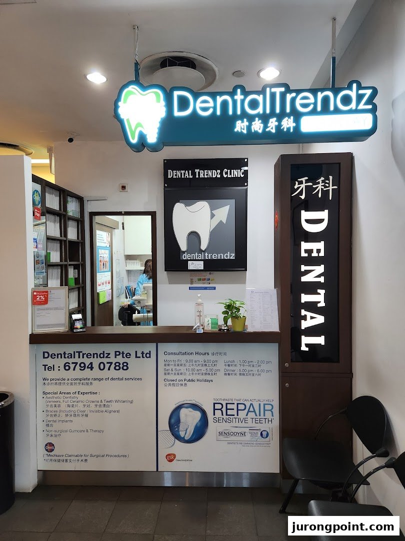 The inviting entrance and reception area of DentalTrendz clinic, highlighting services and consultation hours.