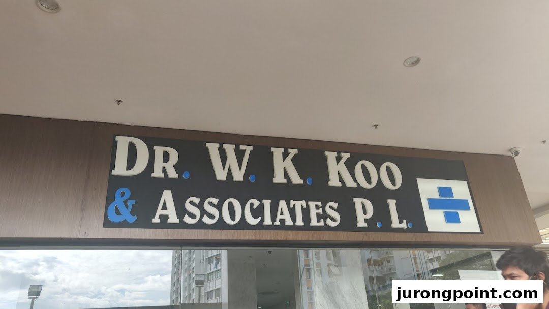 Close-up of the exterior sign for 'Dr. W. K. Koo & Associates P. L.'