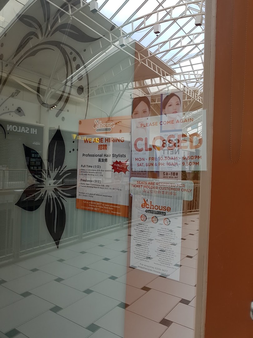 The glass entrance of EC House hair salon, displaying hiring signs, operating hours, and customer information.