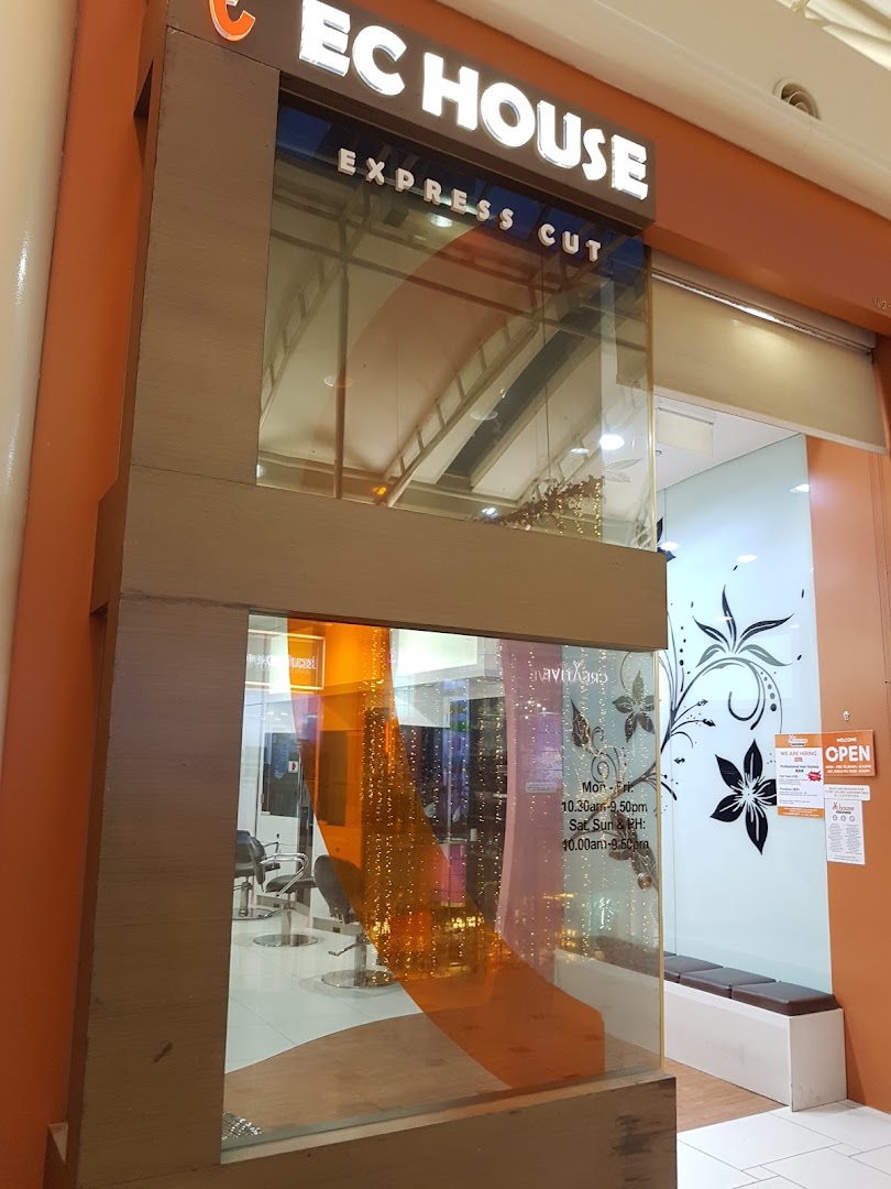 Shopfront of EC House Express Cut, a hair salon, featuring its signage and interior.