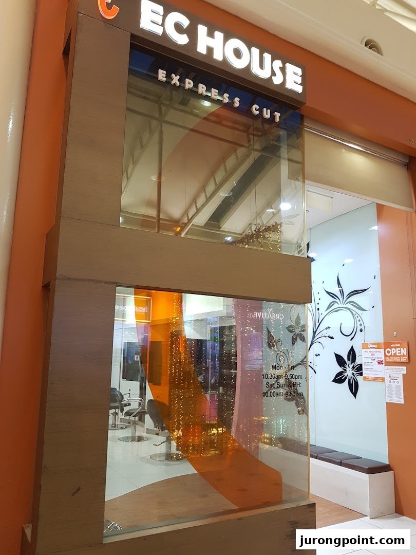 Shopfront of EC House Express Cut, a hair salon, featuring its signage and interior.