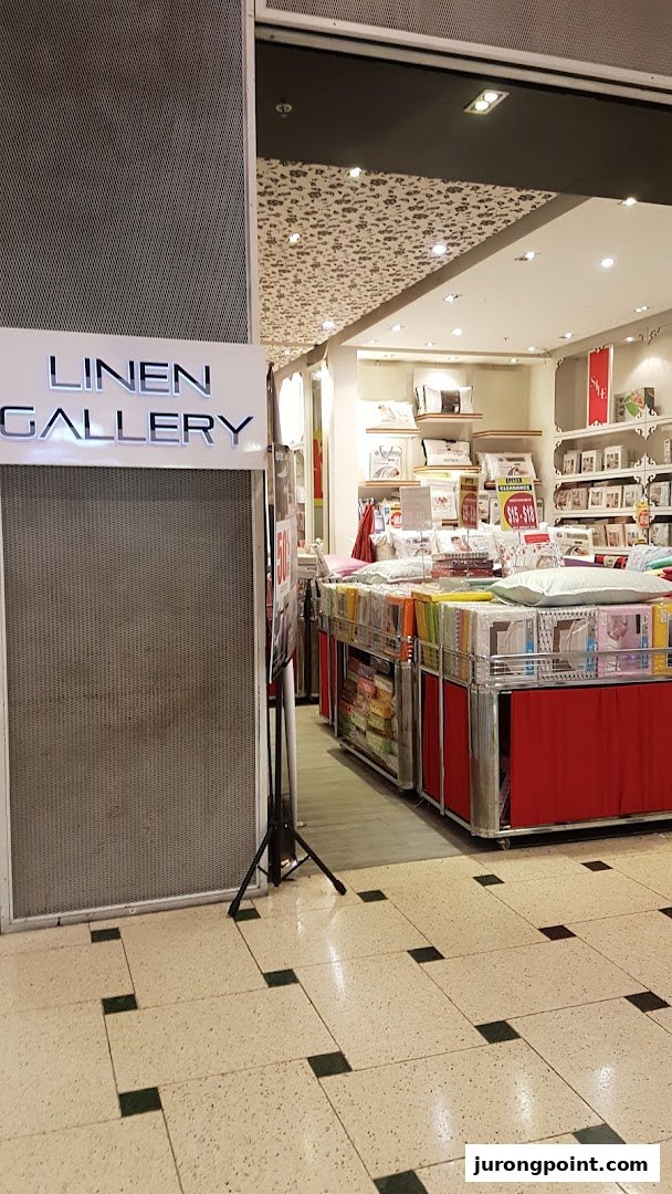 View of Epitex (Linen Gallery) shop entrance showcasing a wide array of bedding and home textiles.